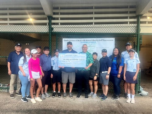 People holding Credit Unions of Maui check.